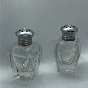 This is a set of vintage Art Deco cut crystal salt and pepper shakers.